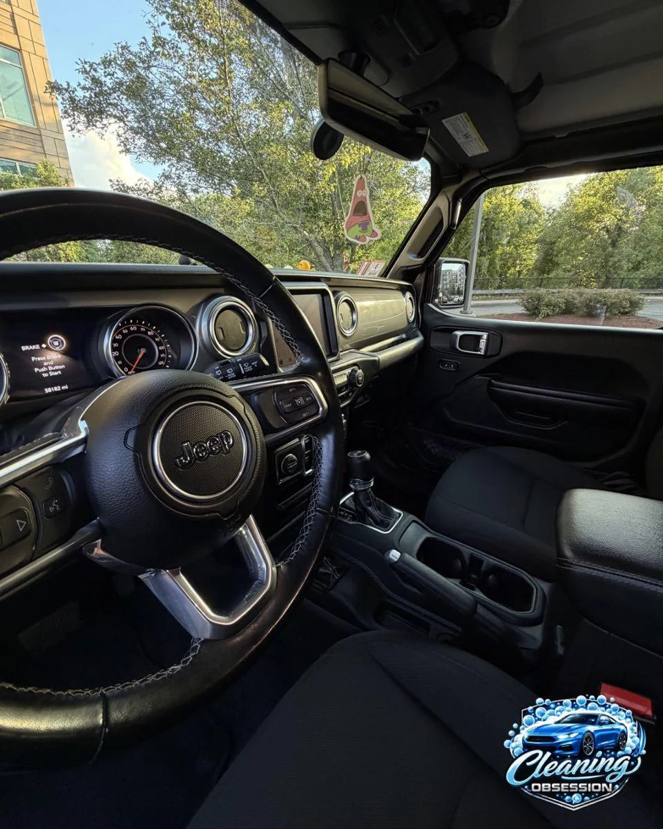 Black Jeep cabin and steering wheel