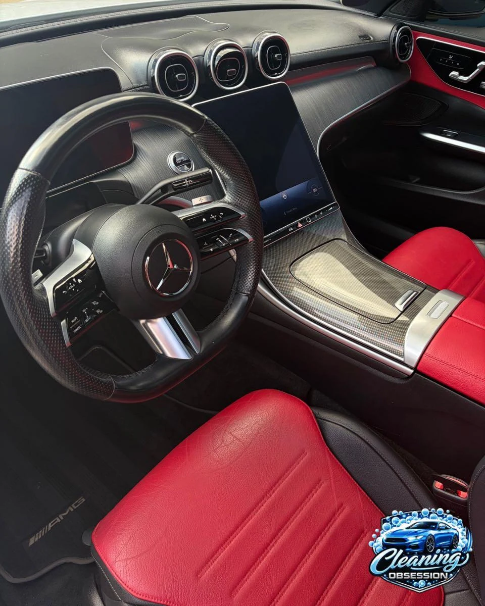 Mercedes steering wheel, dashboard and red driver seat
